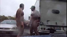 Public Rainy Stroking in a Parking Lot by Two Horny Men