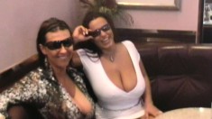 Hot babes Aneta and Kora flash their wonderful big tits on the street